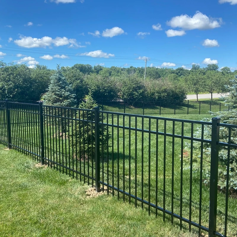 Roanoke fence company Black aluminum fence installation on a landscaped residential lawn