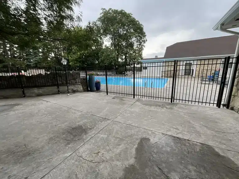 Black aluminum pool fence and gate installation in Fort Wayne, Indiana