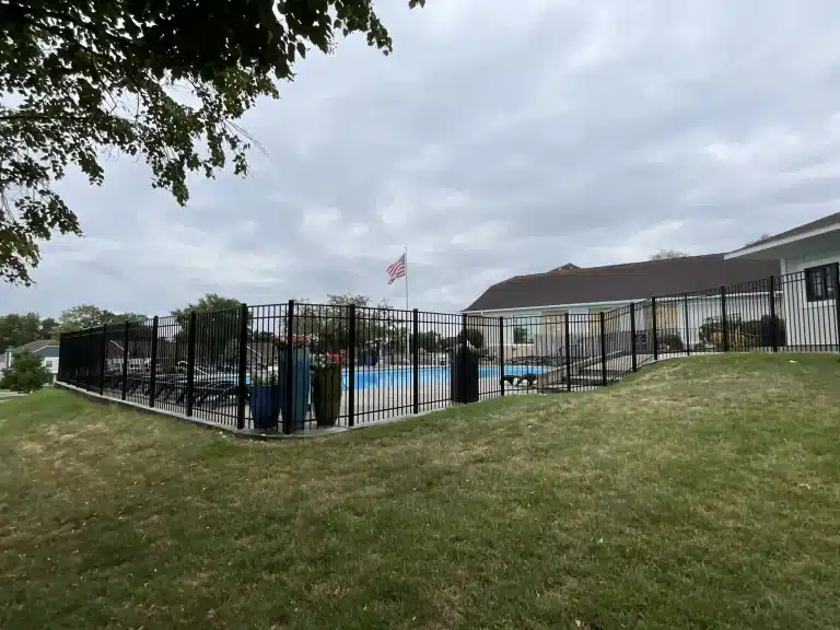 Wide view of black aluminum pool fence installation in Fort Wayne, Indiana